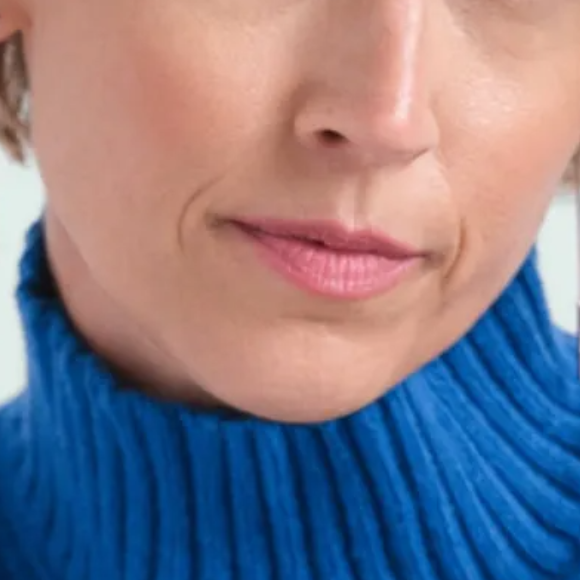 jackie-sqaure-about-hands Photo of lower half of woman's face.